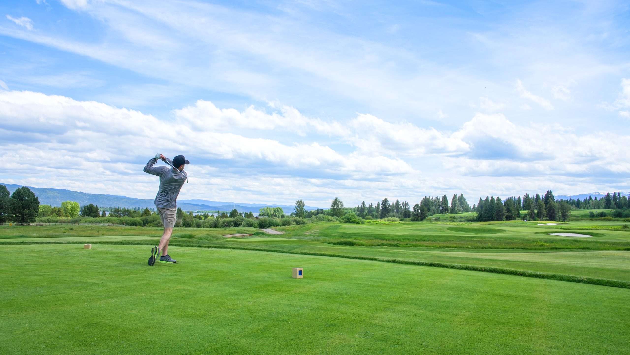 Golfer teeing off